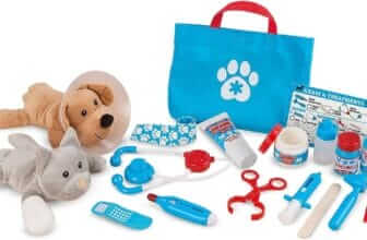 "The Melissa & Doug Pet Vet Play Set laid out, featuring plush dog and cat, toy medical tools like a stethoscope, syringes, and bottles, all against a white background."